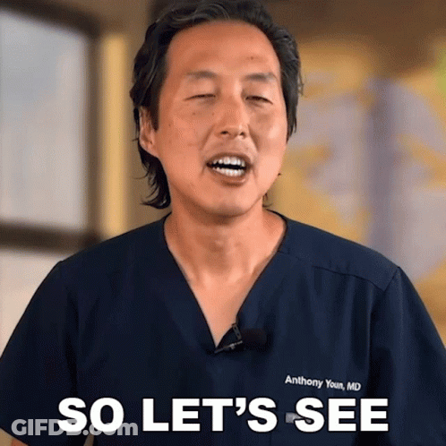 A Man Wearing A Blue Scrub Top Says So Let 'S See GIF