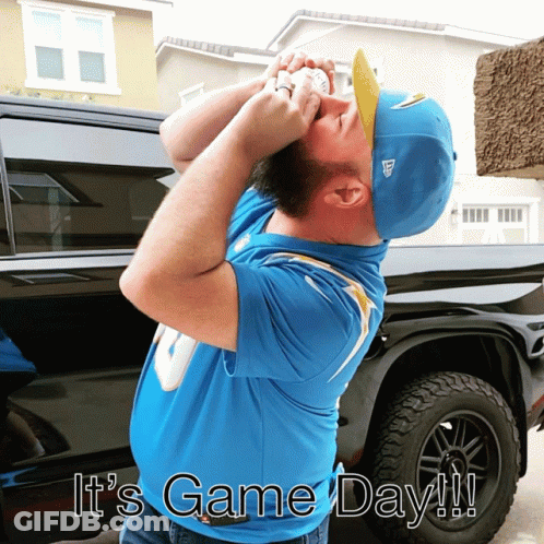 A Man Wearing A Blue Shirt And A Blue Hat With The Words " It 'S Game Day " On The Bottom GIF