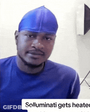 A Man Wearing A Blue Shirt And A Blue Hat With The Words Solluminati Gets Heated On The Bottom GIF