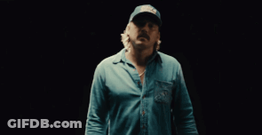A Man Wearing A Blue Shirt And A Hat That Says Field & Stream GIF