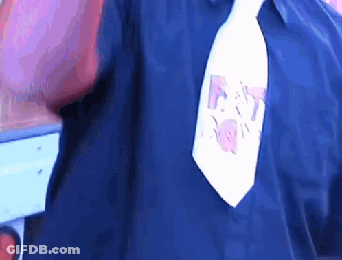 A Man Wearing A Blue Shirt And A White Tie With A Drawing Of A Elephant On It GIF