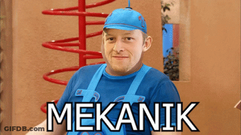 A Man Wearing A Blue Shirt And Overalls With The Word Mekanik On The Bottom GIF
