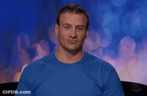 A Man Wearing A Blue Shirt Is Making A Face GIF