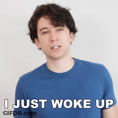 A Man Wearing A Blue Shirt Says I Just Woke Up GIF