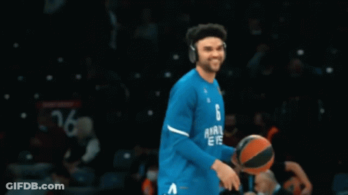 A Man Wearing A Blue Shirt That Says 42 On It GIF