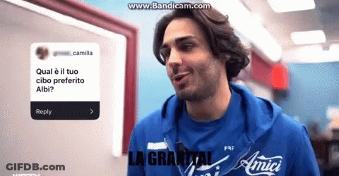 A Man Wearing A Blue Shirt That Says Amici GIF