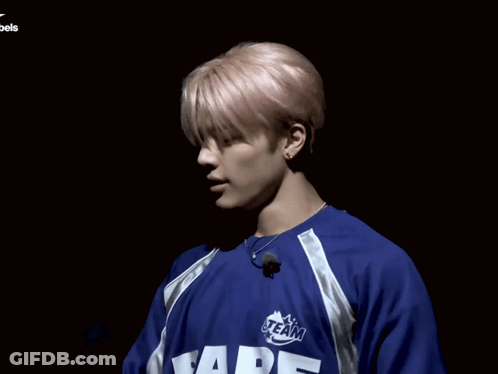 A Man Wearing A Blue Shirt That Says " Bape " On It GIF