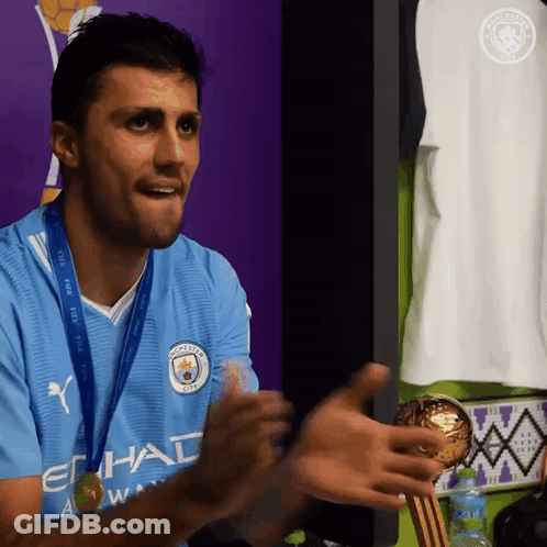 A Man Wearing A Blue Shirt That Says Etihad On It GIF