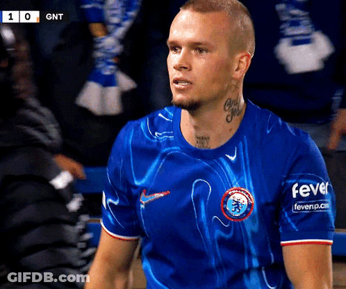 A Man Wearing A Blue Shirt That Says Fever On The Sleeves GIF