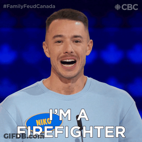 A Man Wearing A Blue Shirt That Says I 'M A Firefighter On It GIF