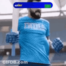 A Man Wearing A Blue Shirt That Says India GIF