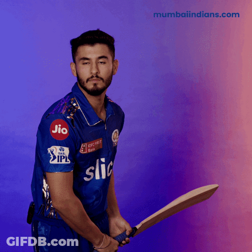 A Man Wearing A Blue Shirt That Says Jio On It Is Holding A Bat GIF
