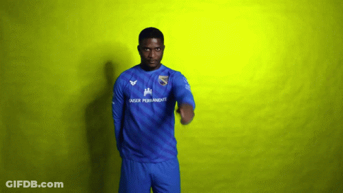 A Man Wearing A Blue Shirt That Says Laser Permanente On It GIF