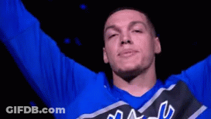 A Man Wearing A Blue Shirt That Says Magic Is Smiling GIF