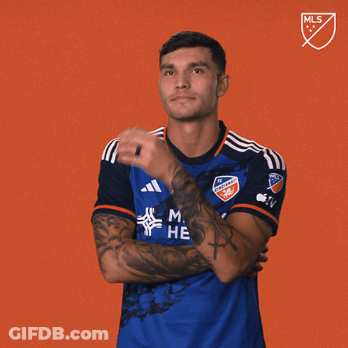 A Man Wearing A Blue Shirt That Says Men 'S Health GIF