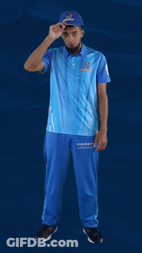 A Man Wearing A Blue Shirt That Says Moments GIF