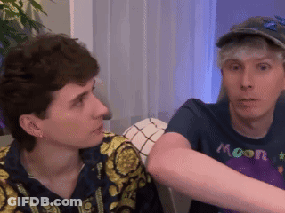 A Man Wearing A Blue Shirt That Says Moon On It GIF