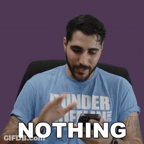 A Man Wearing A Blue Shirt That Says Nothing Looks At His Phone GIF
