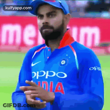 A Man Wearing A Blue Shirt That Says Oppo India On It GIF