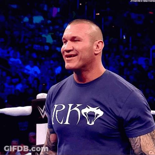 A Man Wearing A Blue Shirt That Says Rko GIF