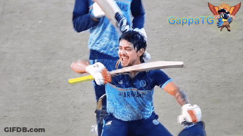 A Man Wearing A Blue Shirt That Says ' Sharkland ' On It GIF