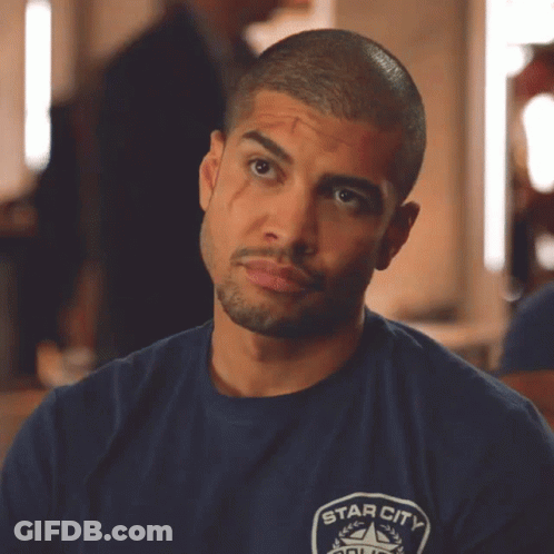 A Man Wearing A Blue Shirt That Says Star City On The Front GIF
