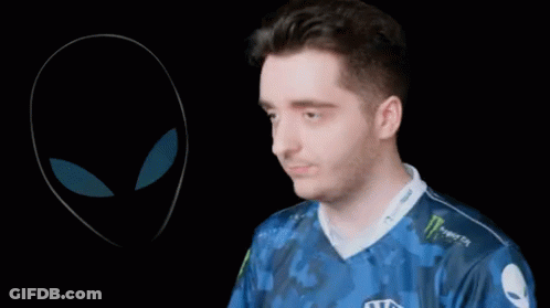 A Man Wearing A Blue Shirt That Says Team Liquid Adjusts His Headphones GIF