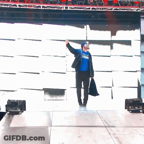 A Man Wearing A Blue Shirt That Says The Next Thing Is Waving GIF