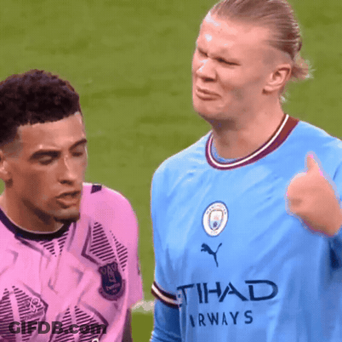 A Man Wearing A Blue Shirt That Says Tihad Airways GIF