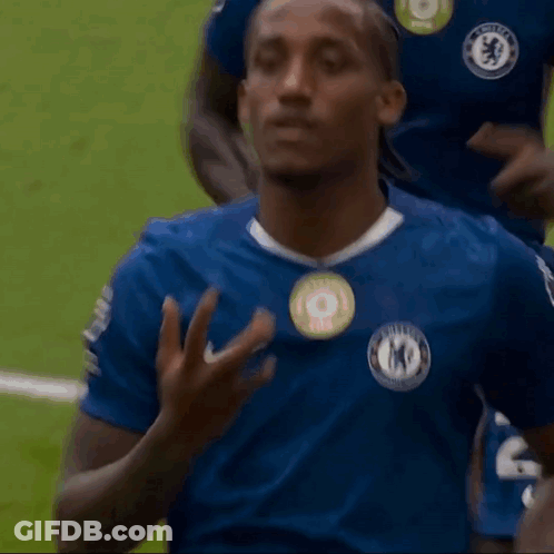 A Man Wearing A Blue Shirt With A Badge That Says Chelsea On It GIF