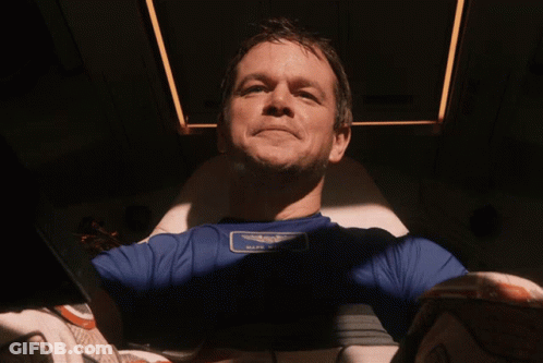 A Man Wearing A Blue Shirt With A Patch That Says " Half Moon " GIF