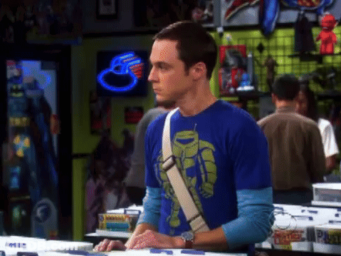 Man In Blue Shirt With Robot Stands In Store GIF
