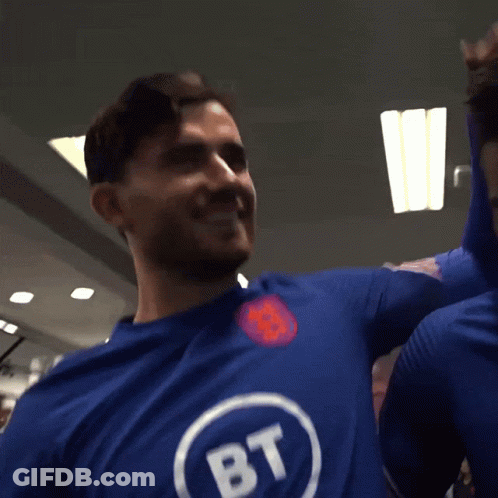 A Man Wearing A Blue Shirt With Bt Written On It GIF