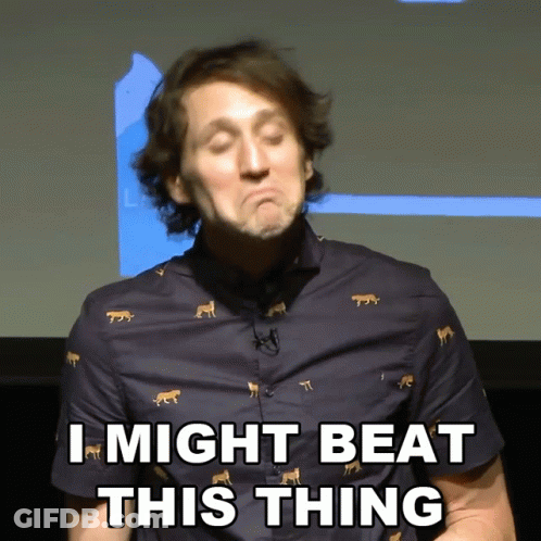A Man Wearing A Blue Shirt With Leopards On It Says I Might Beat This Thing GIF