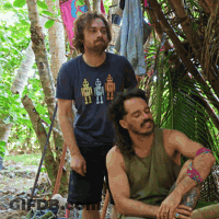 A Man Wearing A Blue Shirt With Robots On It GIF