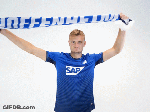 A Man Wearing A Blue Shirt With Sap On It GIF