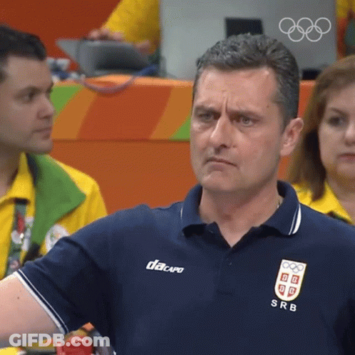 A Man Wearing A Blue Shirt With Srb On The Front GIF