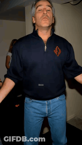 A Man Wearing A Blue Shirt With The Letter G On The Front GIF