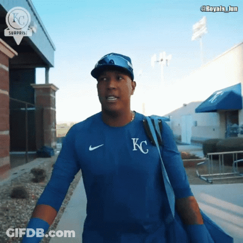 A Man Wearing A Blue Shirt With The Letter Kc On The Front GIF