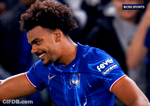 A Man Wearing A Blue Shirt With The Word Fever On The Sleeve GIF