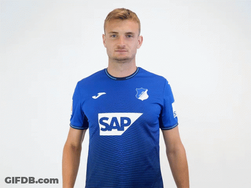 A Man Wearing A Blue Shirt With The Word Sap On The Front GIF