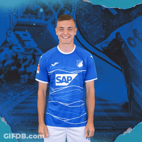 A Man Wearing A Blue Shirt With The Word Sap On The Front GIF