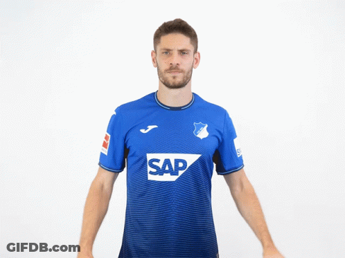 A Man Wearing A Blue Shirt With The Word Sap On The Front GIF