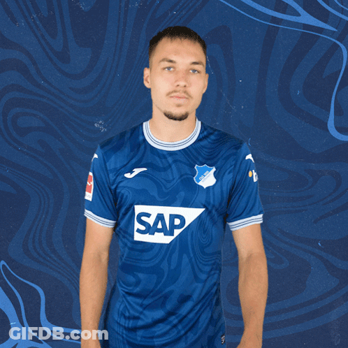 A Man Wearing A Blue Shirt With The Word Sap On The Front GIF