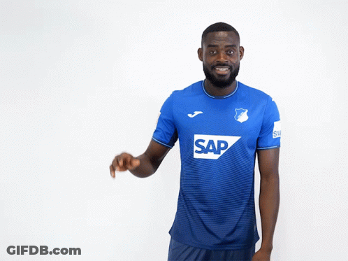 A Man Wearing A Blue Shirt With The Word Sap On The Front GIF