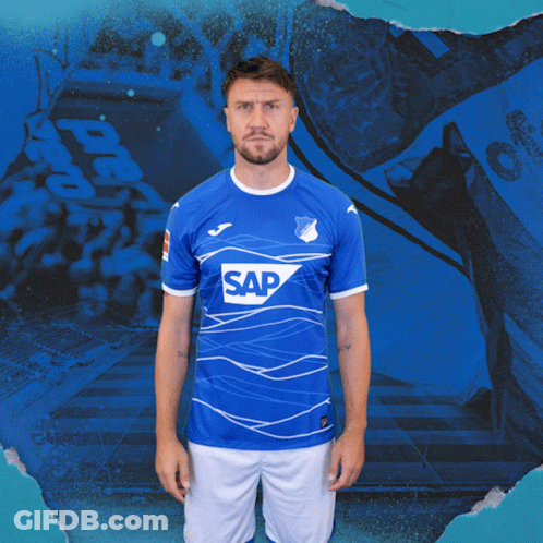 A Man Wearing A Blue Shirt With The Word Sap On The Front GIF
