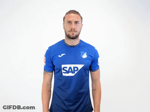 A Man Wearing A Blue Shirt With The Word Sap On The Front GIF