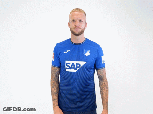 A Man Wearing A Blue Shirt With The Word Sap On The Front GIF