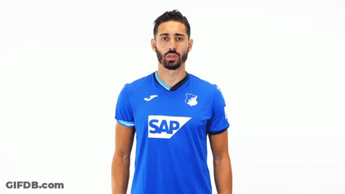 A Man Wearing A Blue Shirt With The Word Sap On The Front GIF