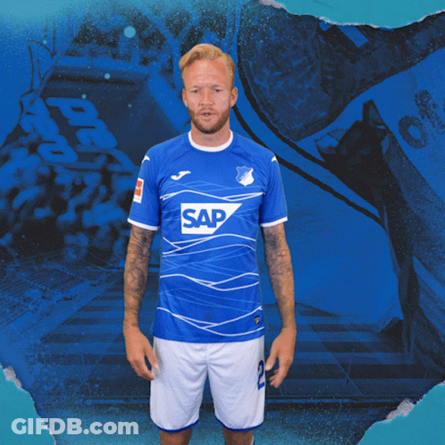 A Man Wearing A Blue Shirt With The Word Sap On The Front GIF
